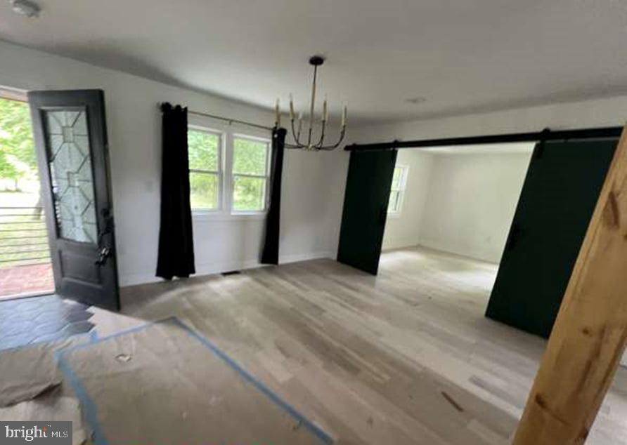 439 Erial Road Sicklerville, NJ 08081 - Photo 6 of 20 a view of empty room with wooden floor and fan