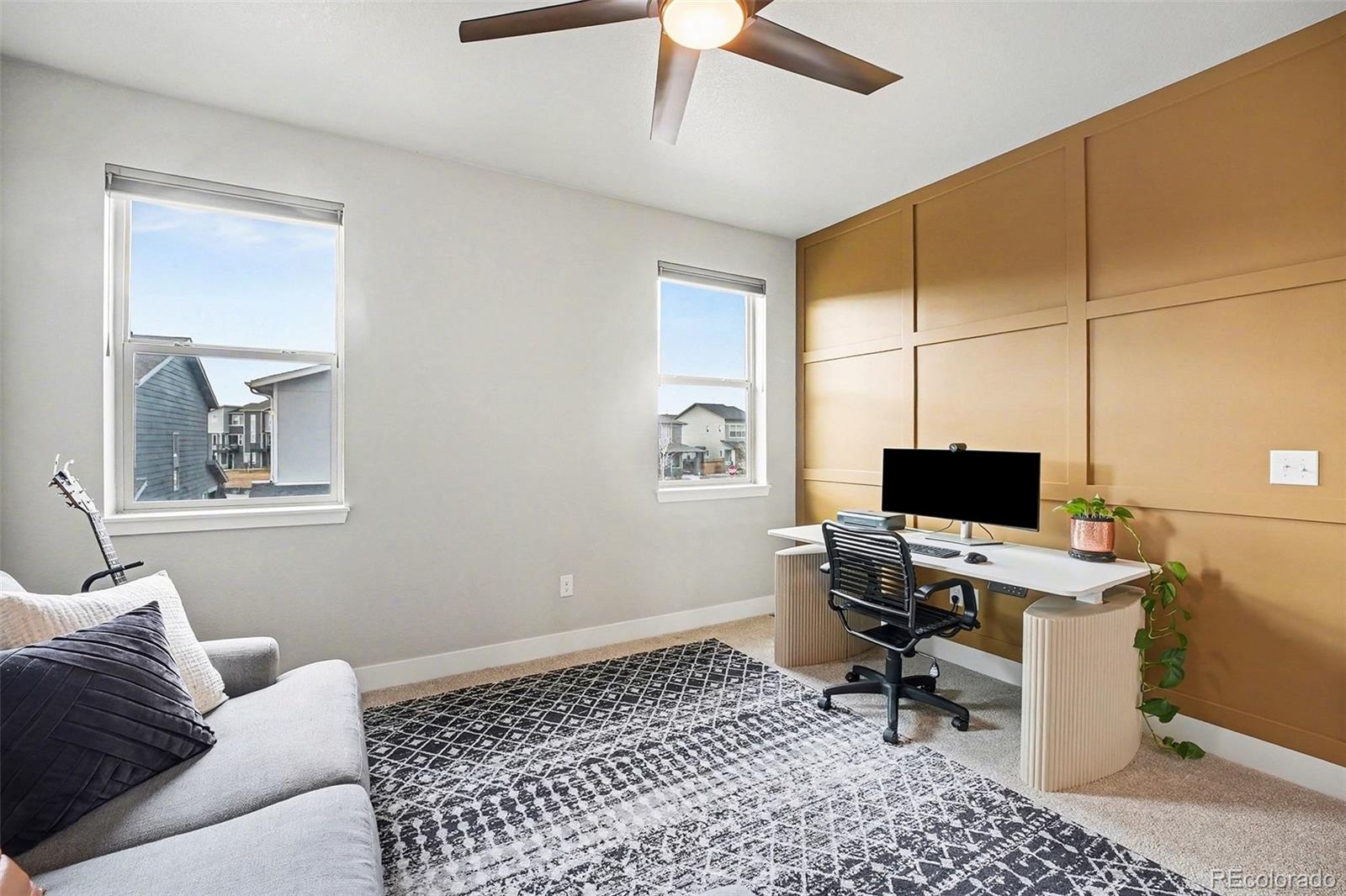 6793 Canosa Street Denver, CO 80221 - Photo 15 of 34 a workspace with a couch