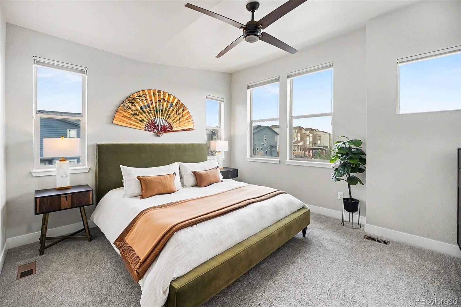 6793 Canosa Street Denver, CO 80221 - Photo 18 of 34 a bedroom with a bed and a window