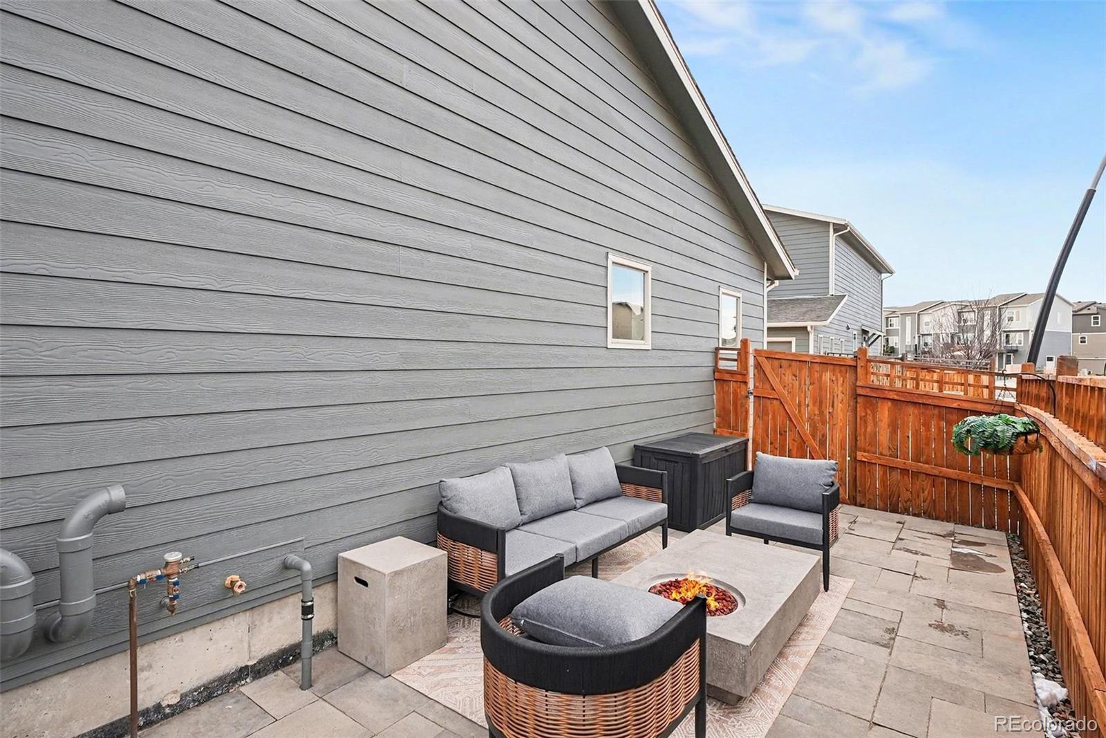 6793 Canosa Street Denver, CO 80221 - Photo 29 of 34 a balcony with outdoor seating and stairs