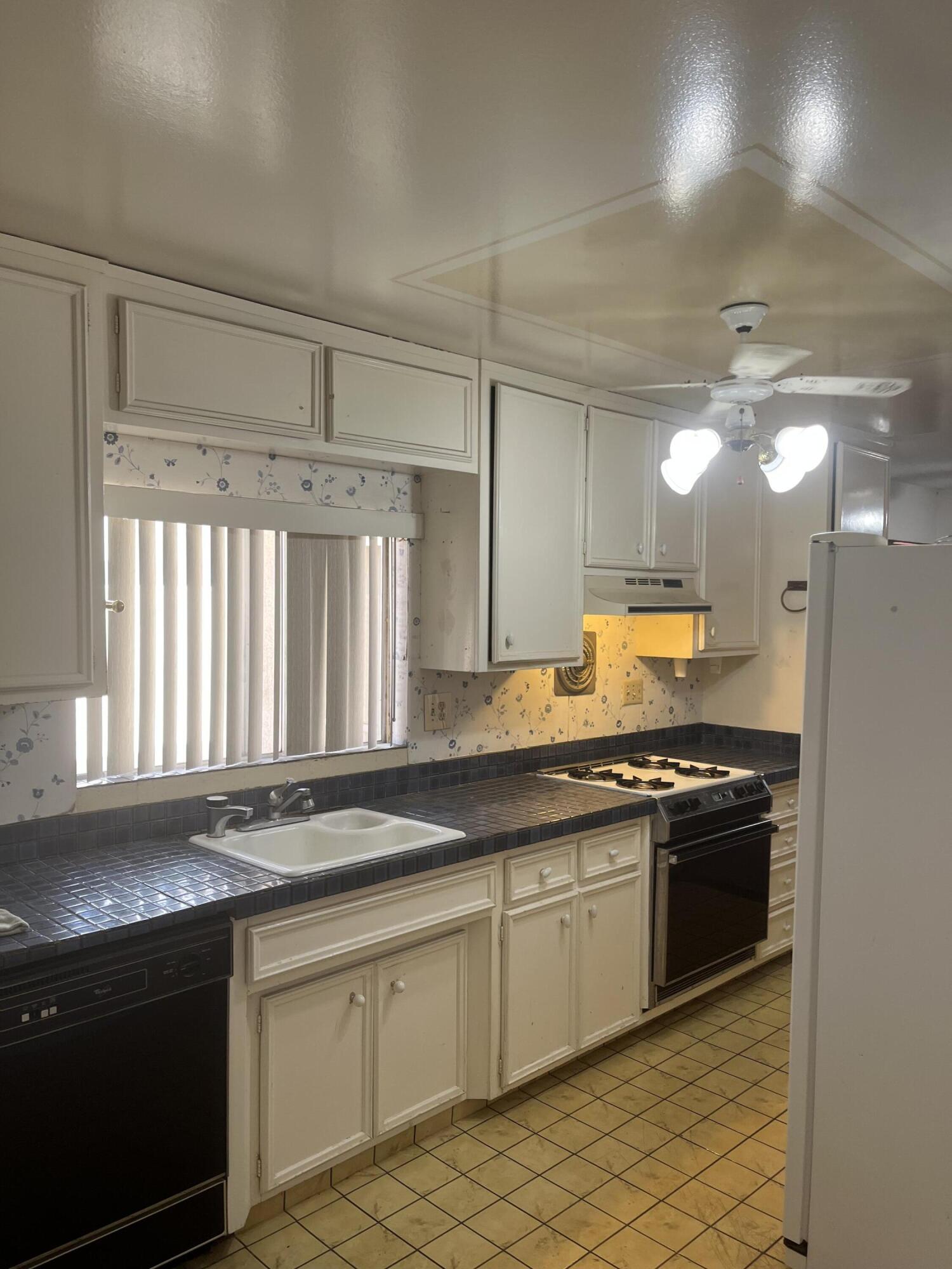 37520 Da Vall Drive Rancho Mirage, CA 92270 - Photo 12 of 23 a kitchen with stainless steel appliances granite countertop a sink stove and cabinets