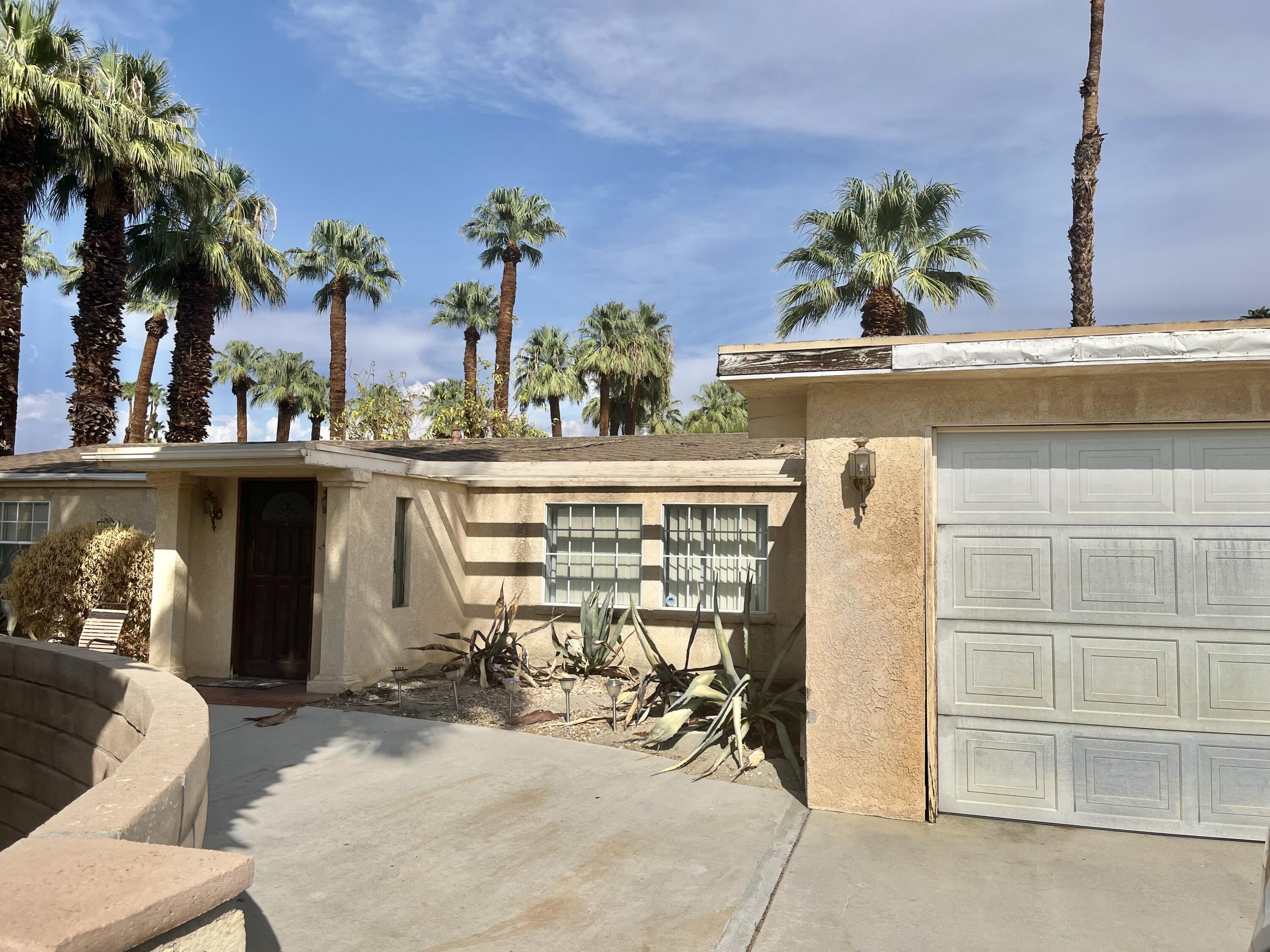 37520 Da Vall Drive Rancho Mirage, CA 92270 - Photo 5 of 23 a view of a dining room with furniture and a potted plant