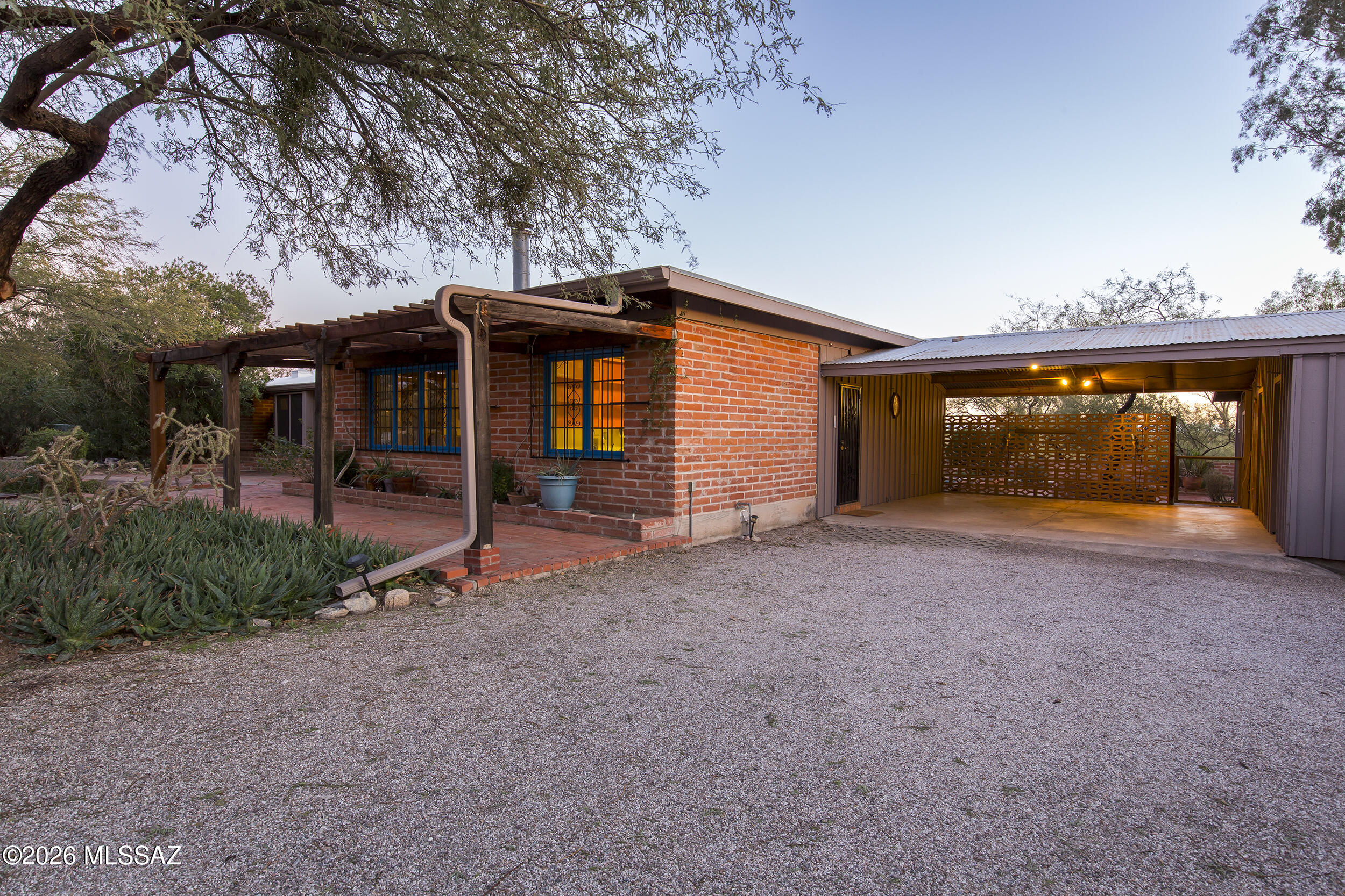 4130 East River Road Tucson, AZ 85718 - Photo 44 of 46 a front view of a house with garden