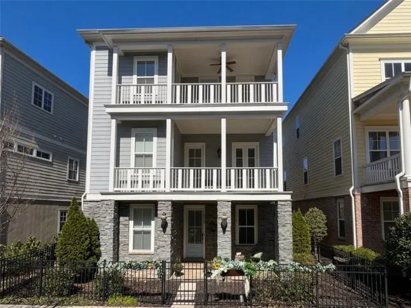 a front view of a building with many windows