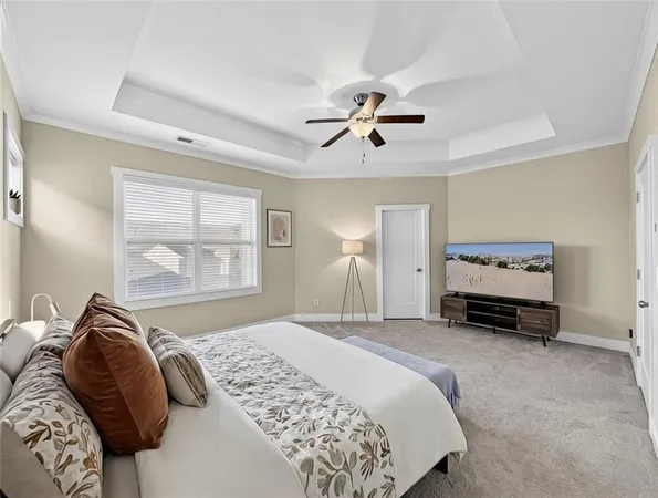 a en suite bathroom with a double vanity sink a large mirror and a shower