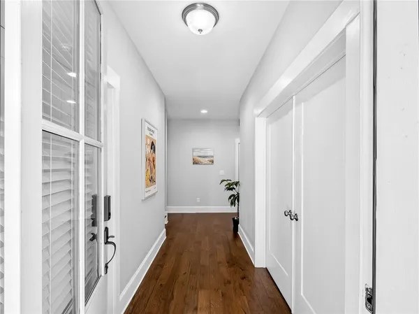 a view of entryway with stairs and wooden floor