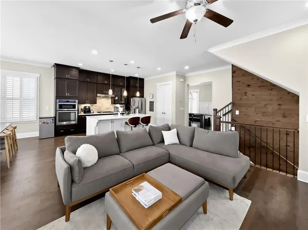 a living room with furniture a fireplace and a flat screen tv
