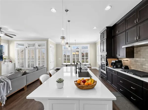 a living room with furniture a table and a fireplace