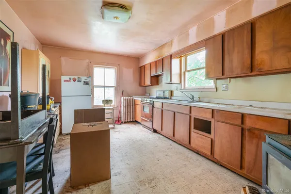 a kitchen with stainless steel appliances granite countertop a stove a sink dishwasher and a refrigerator