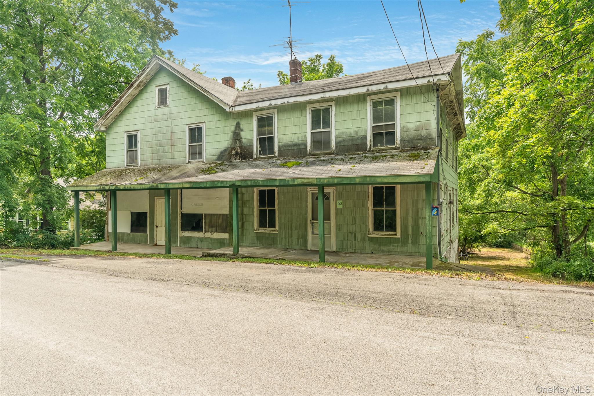 50 Maple Street Catskill, NY 12414 - Photo 3 of 27 a front view of a house with a garden