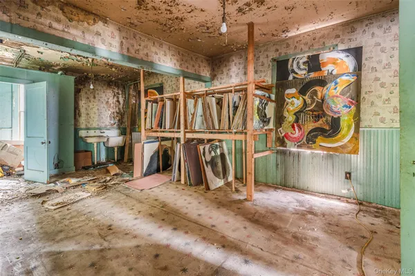 a view of a room with wooden walls