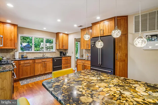 a living room with furniture pool table and a flat screen tv