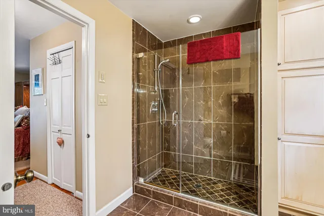 a bed room with a bed and a large window