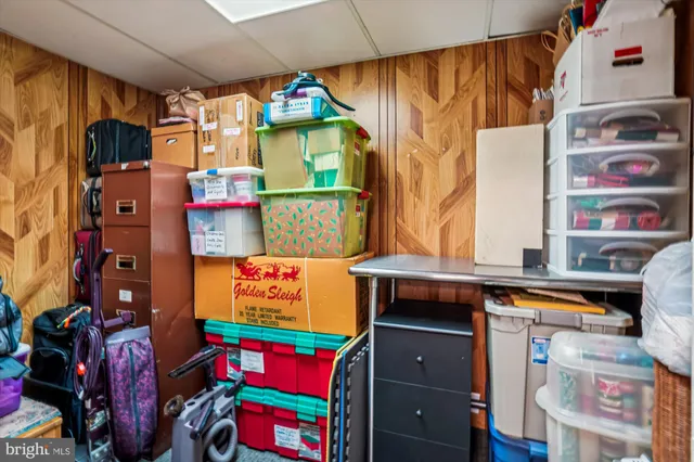 a view of a wooden deck and a yard with wooden fence