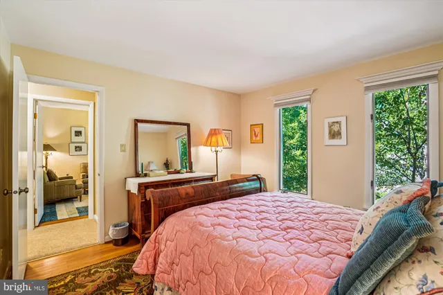 a view of a livingroom with workspace and a window
