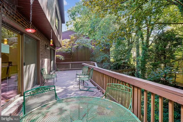 a bedroom with a bed and a mirror on dresser