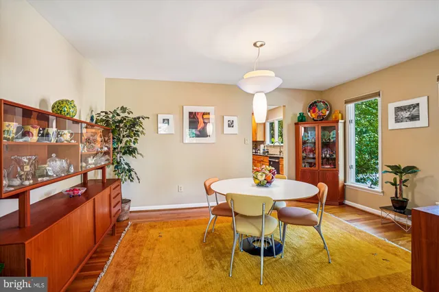 a kitchen with granite countertop a refrigerator and a stove top oven