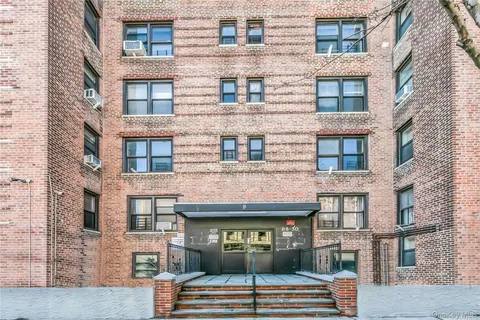 a view of a brick building with many windows