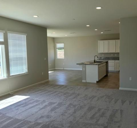 21113 Pinot Noir Drive Patterson, CA 95363 - Photo 2 of 5 an empty room with kitchen and window