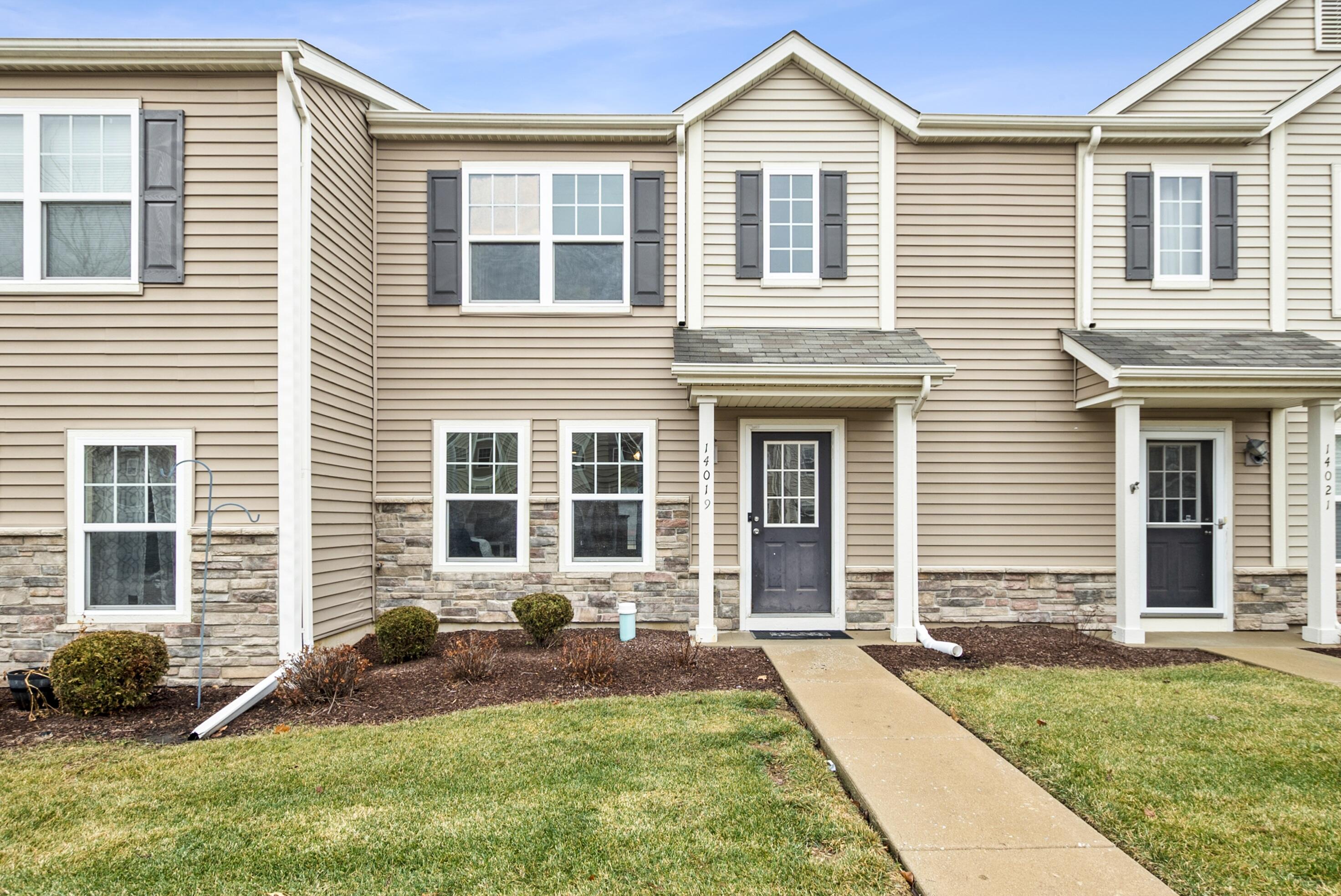 14019 Paramount Way Cedar Lake, IN 46303 - Photo 1 of 11 a front view of a house with a yard
