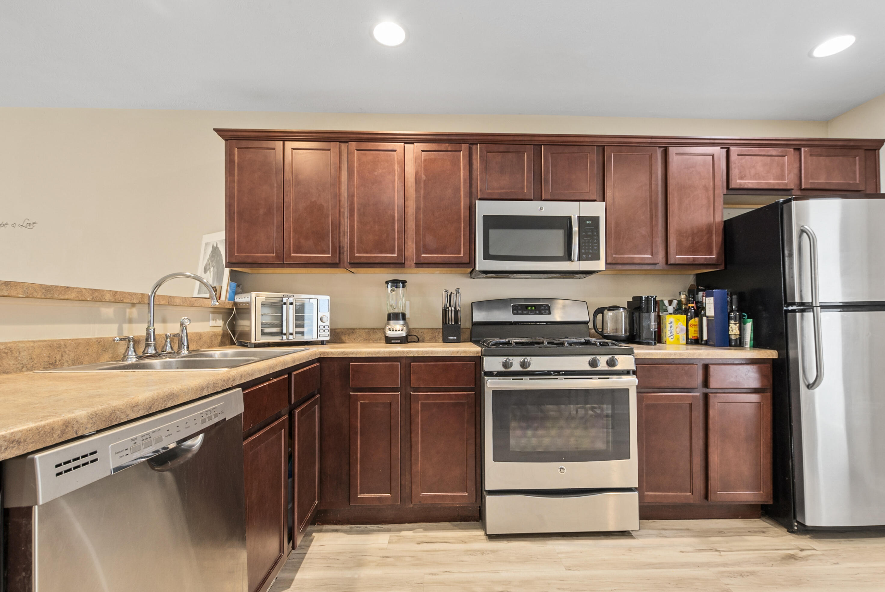 14019 Paramount Way Cedar Lake, IN 46303 - Photo 5 of 11 a kitchen with a sink stove and refrigerator