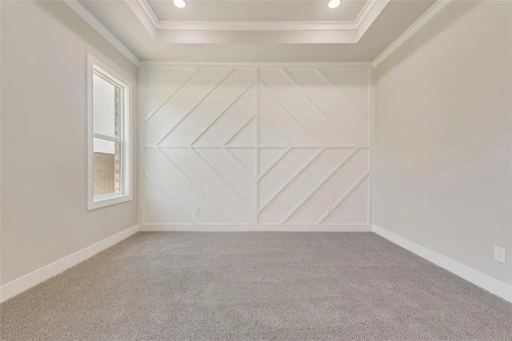 1327 Selby Road Van Alstyne, TX 75495 - Photo 20 of 32 Carpeted spare room with ornamental molding and a decorative wall