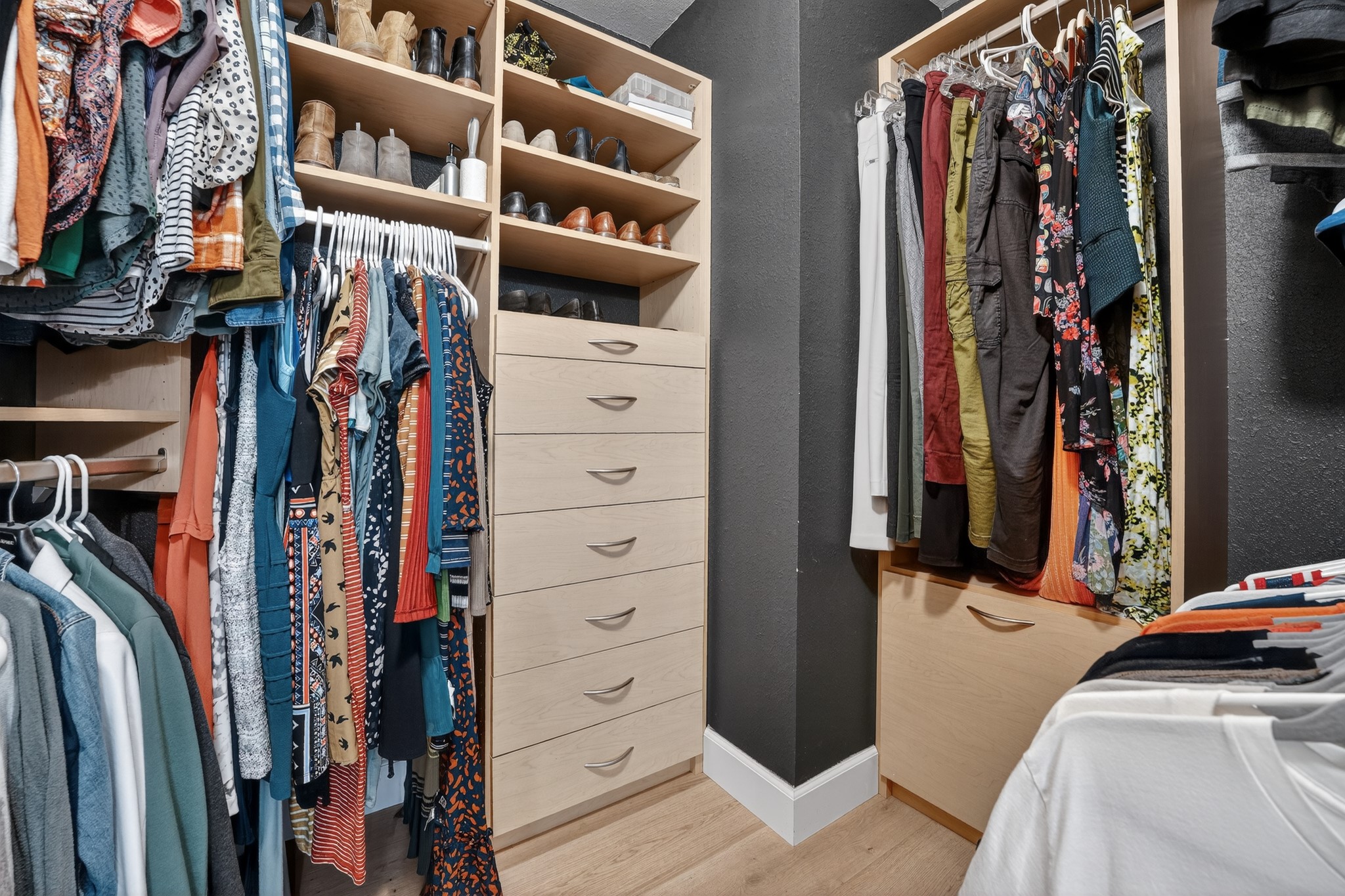 1811 Old Mill Road Cedar Park, TX 78613 - Photo 25 of 39 This custom-built walk-in closet features ample storage solutions with integrated drawers and shelving.