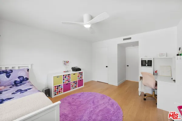 a bed room with a bed and a tv