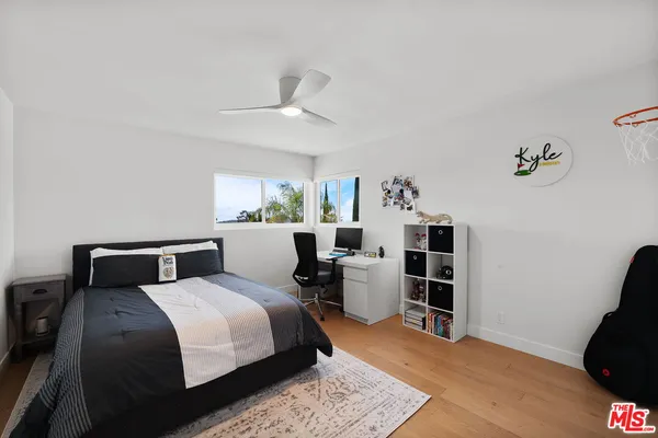 a bedroom with a bed furniture and a window