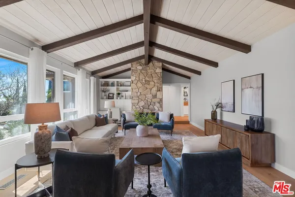 a view of a livingroom with furniture and window