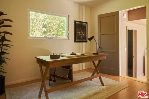 a view of a workspace with furniture