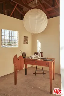 a workspace with furniture and window