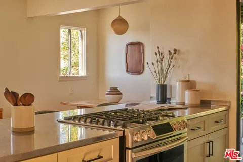 a kitchen with a stove and a sink