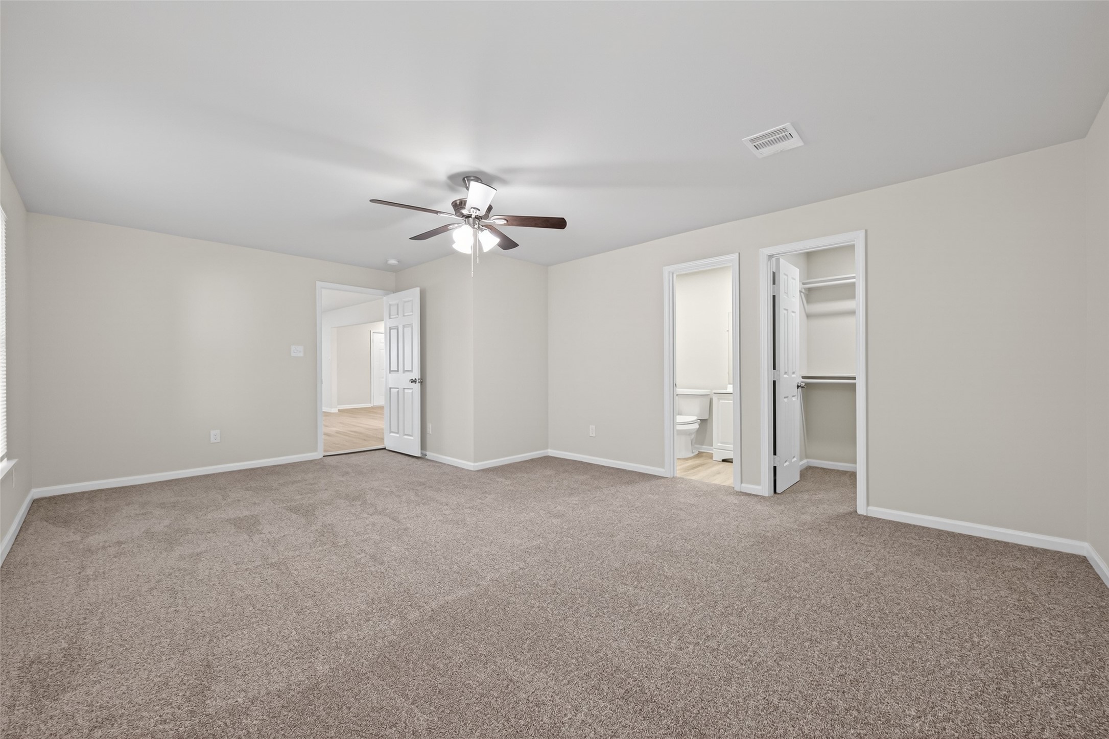 1238 Hopper Road Houston, TX 77037 - Photo 11 of 40 a view of an empty room with a chandelier fan