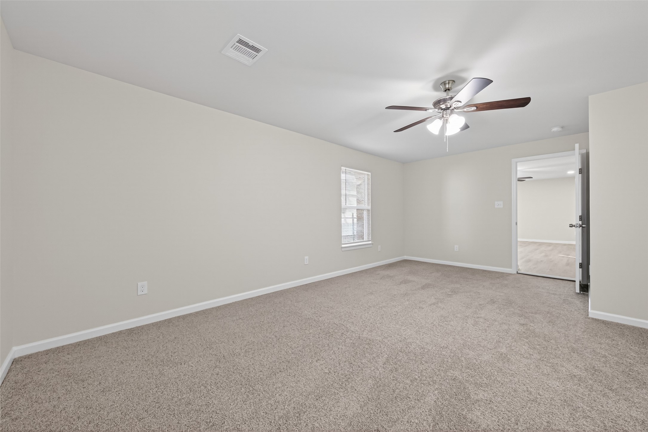 1238 Hopper Road Houston, TX 77037 - Photo 12 of 40 a view of an empty room with a window