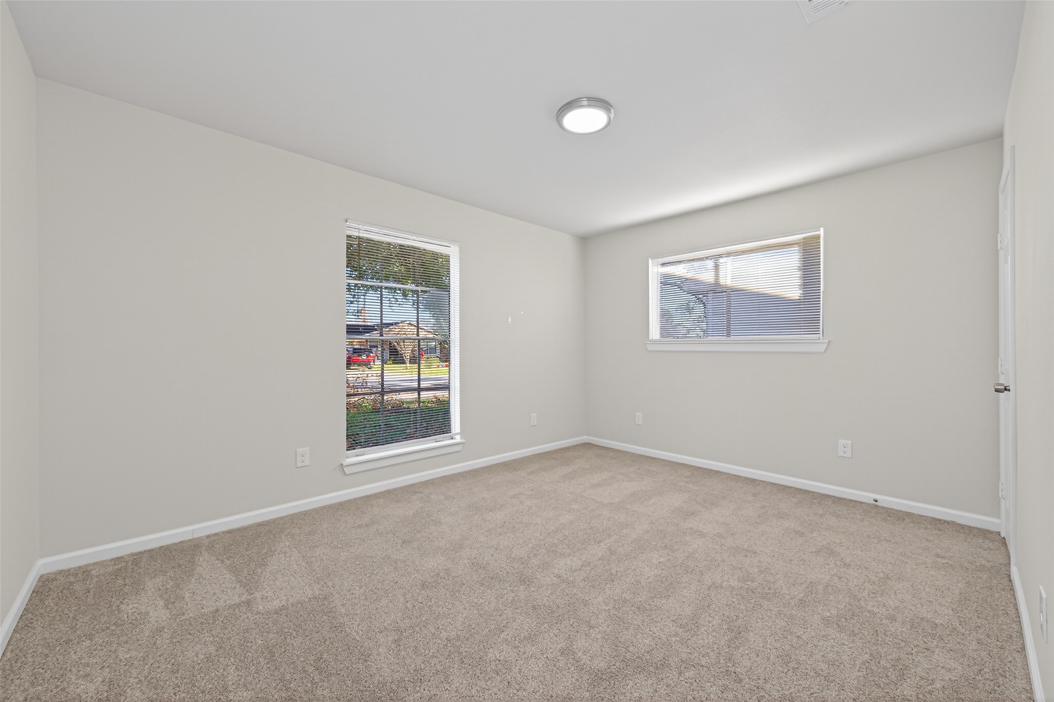 1238 Hopper Road Houston, TX 77037 - Photo 13 of 40 an empty room with windows