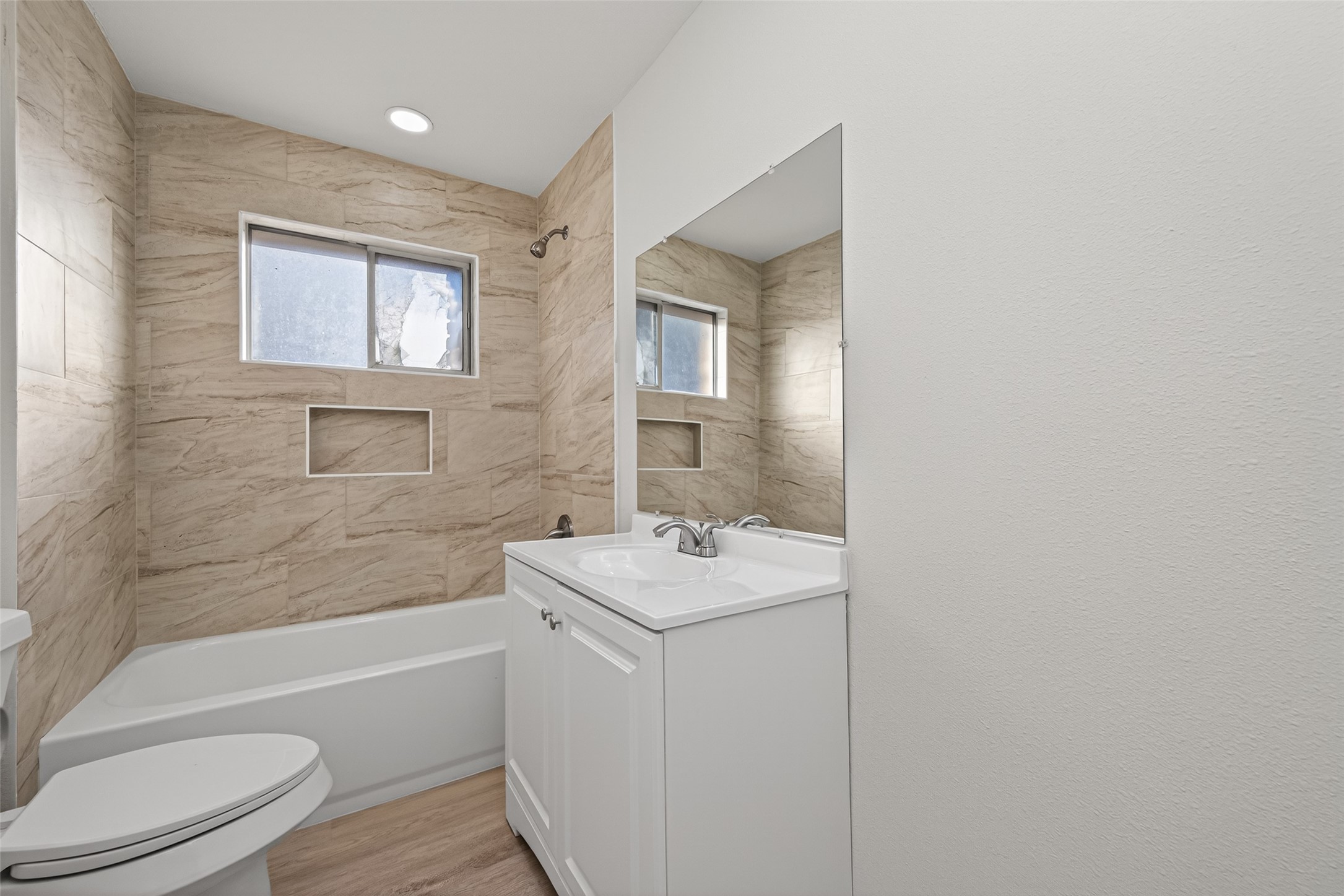1238 Hopper Road Houston, TX 77037 - Photo 15 of 40 a bathroom with a sink toilet vanity and bathtub