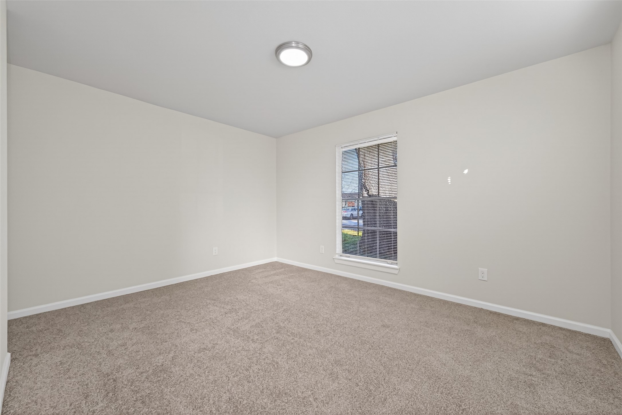 1238 Hopper Road Houston, TX 77037 - Photo 17 of 40 an empty room with windows