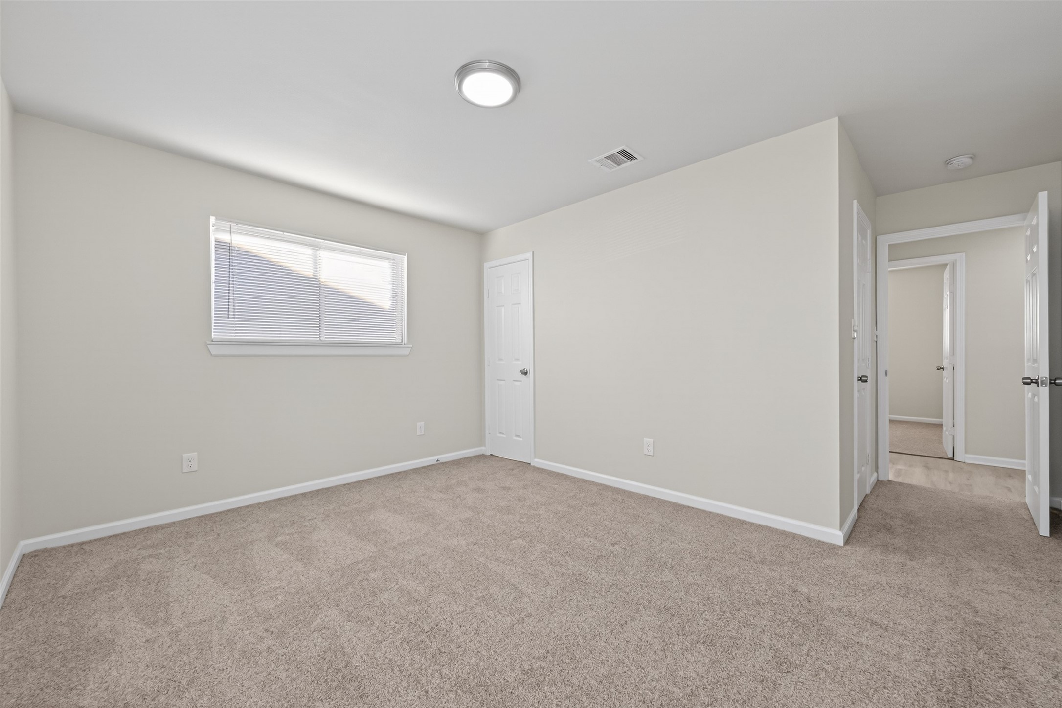 1238 Hopper Road Houston, TX 77037 - Photo 20 of 40 an empty room with a window