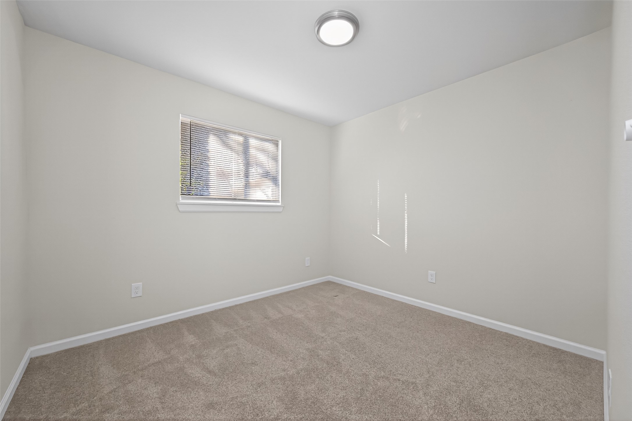 1238 Hopper Road Houston, TX 77037 - Photo 21 of 40 an empty room with windows