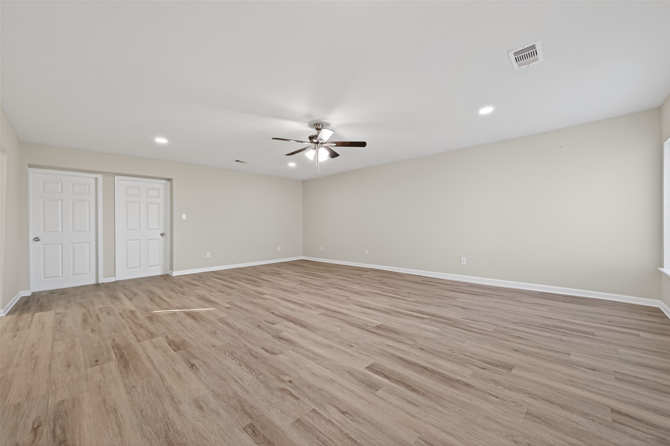 1238 Hopper Road Houston, TX 77037 - Photo 24 of 40 a view of an empty room with wooden floor