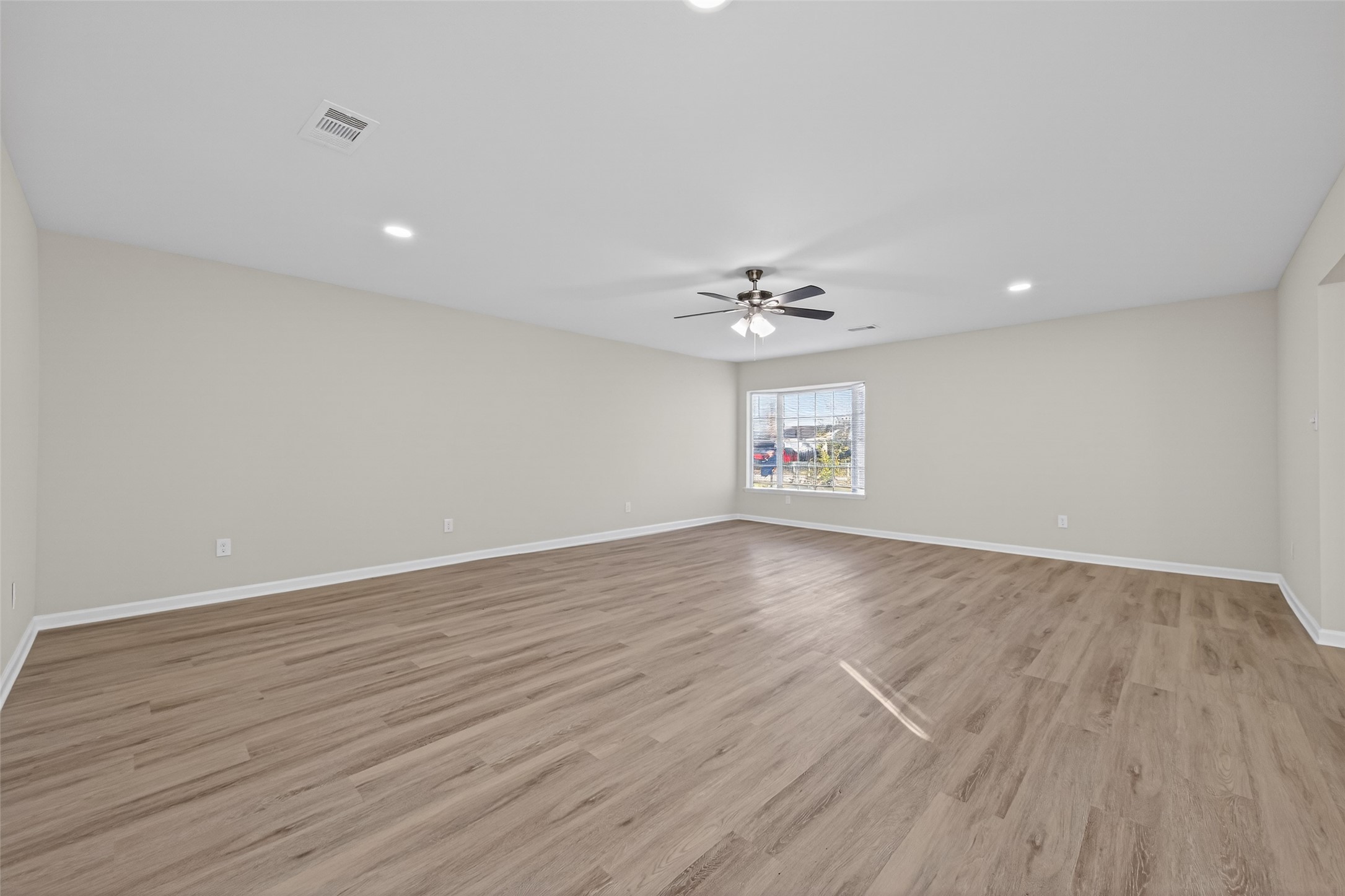 1238 Hopper Road Houston, TX 77037 - Photo 29 of 40 a view of an empty room with wooden floor and chandelier