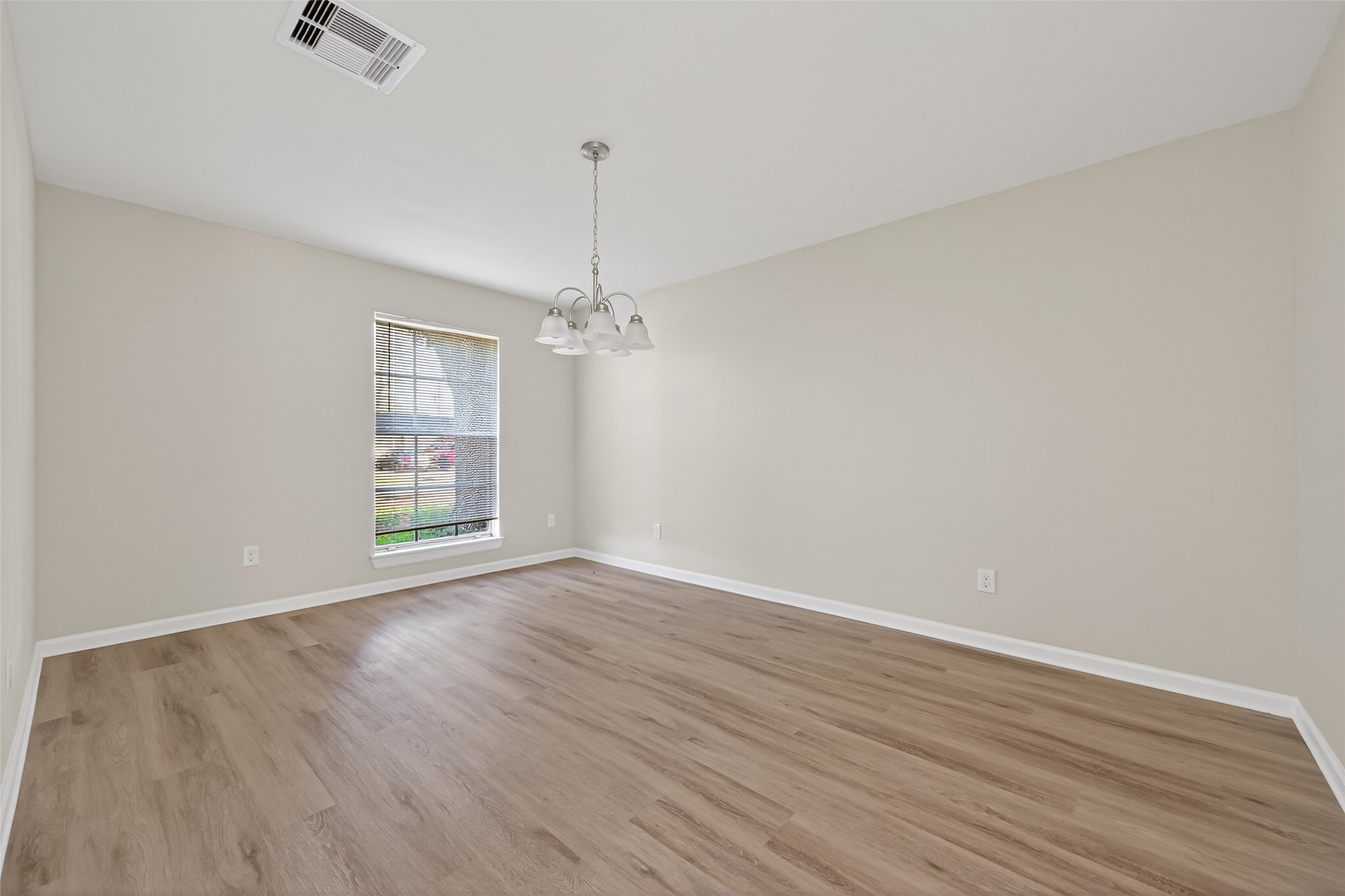 1238 Hopper Road Houston, TX 77037 - Photo 31 of 40 wooden floor in an empty room with a window
