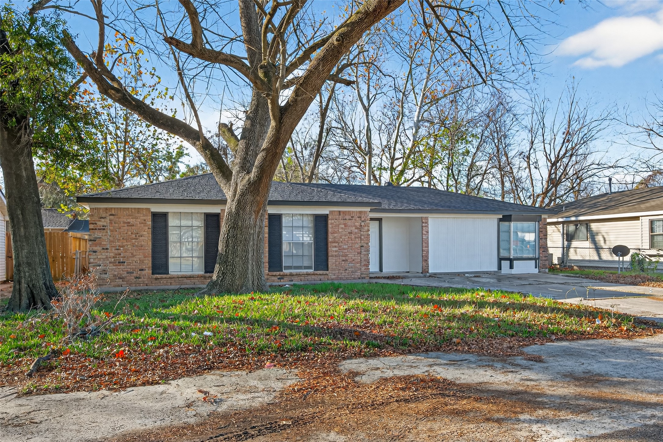 1238 Hopper Road Houston, TX 77037 - Photo 37 of 40 a front view of house with yard and trees around