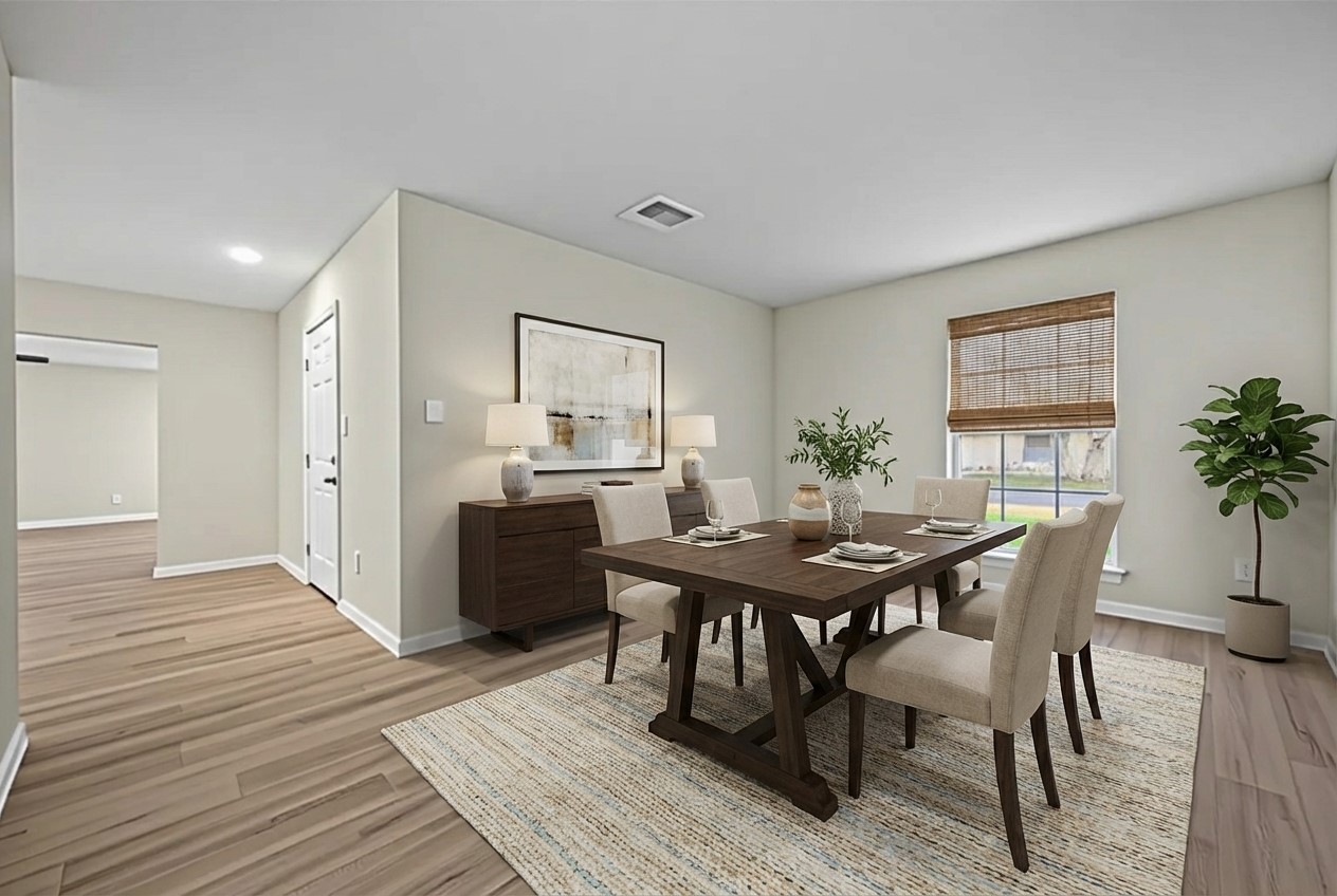 1238 Hopper Road Houston, TX 77037 - Photo 4 of 40 a view of a dining room with furniture and wooden floor