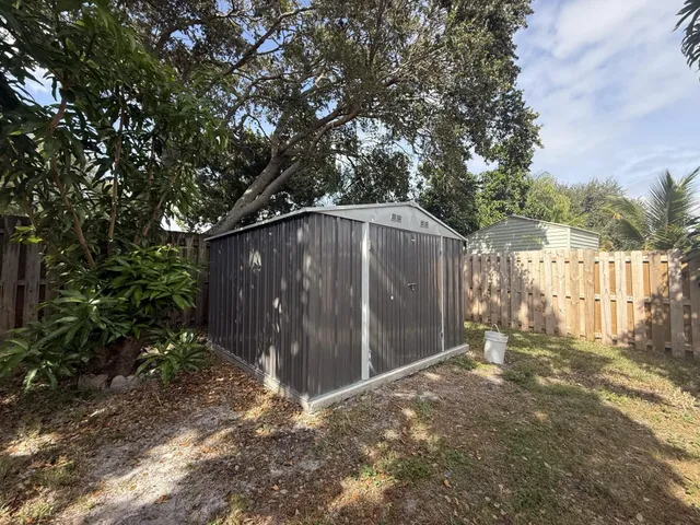 an aerial view of a house with yard swimming pool and outdoor seating