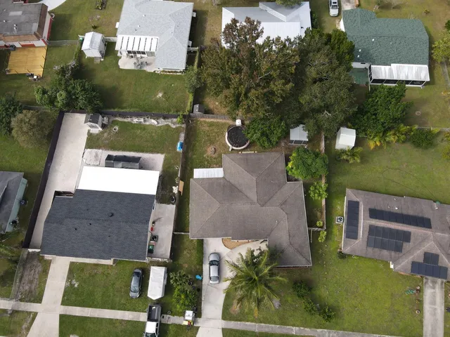 a view of a house with a yard and plants