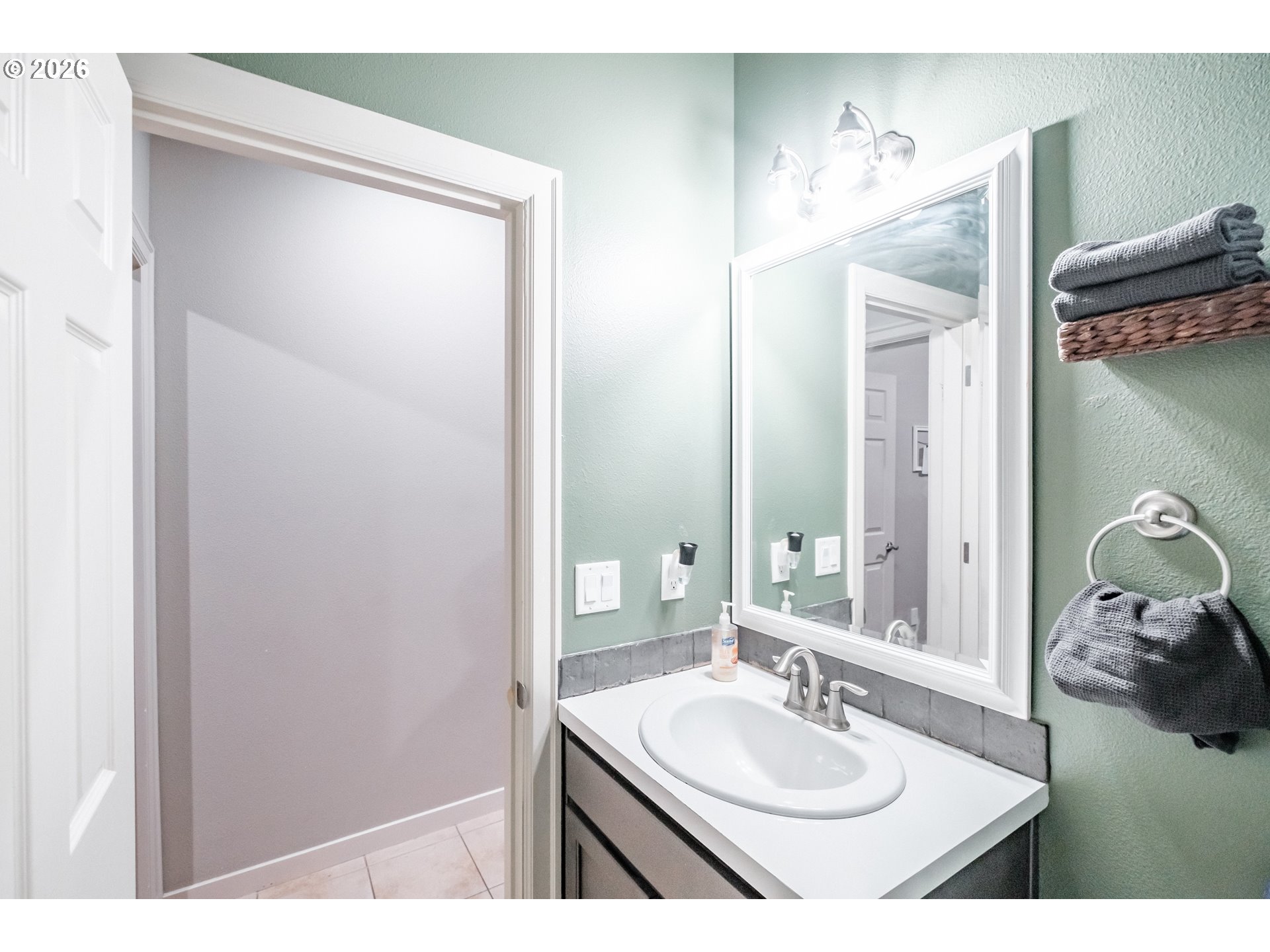 1000 Tasha Way Lebanon, OR 97355 - Photo 14 of 48 a bathroom with a sink and a mirror
