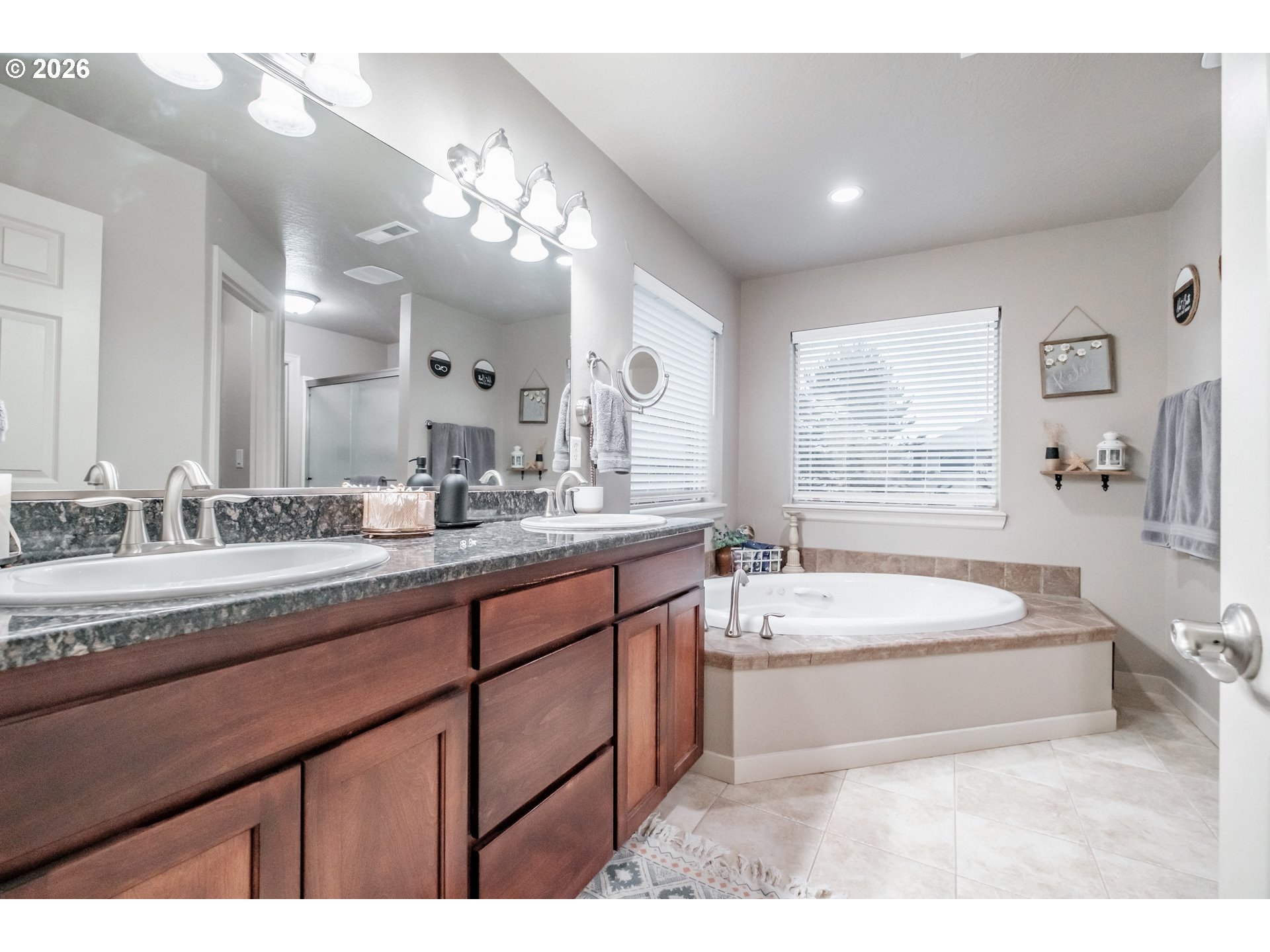 1000 Tasha Way Lebanon, OR 97355 - Photo 20 of 48 a spacious bathroom with a sink double vanity large mirror and bathtub