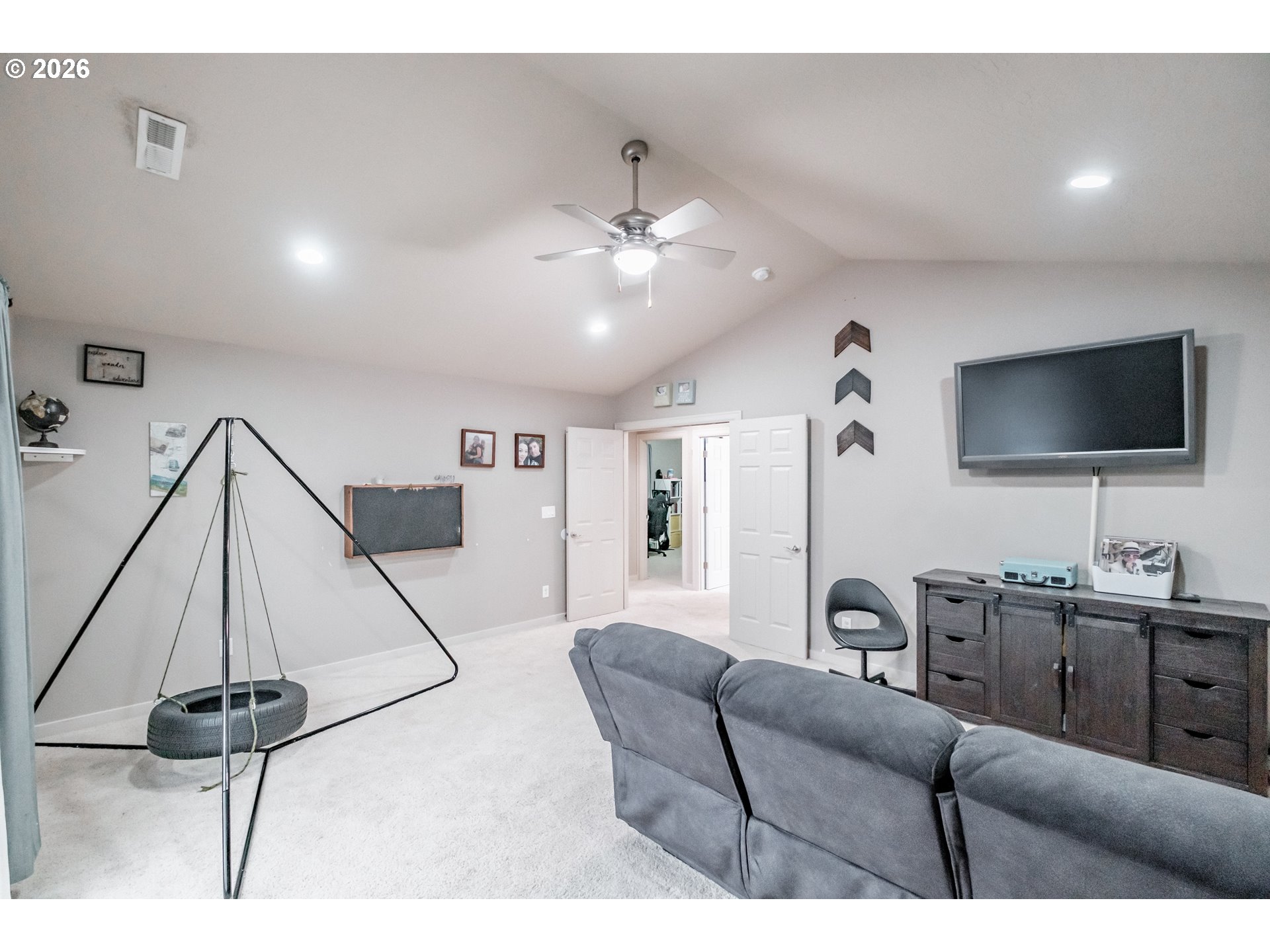 1000 Tasha Way Lebanon, OR 97355 - Photo 32 of 48 a living room with furniture and a flat screen tv